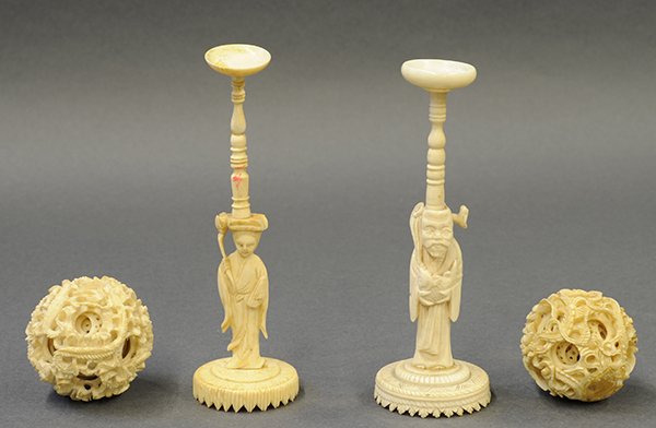 Chinese Ivory Carved Puzzle Balls: (lot of 2) Chinese ivory puzzle balls, late Qing/Republic period, carved with dragons concealing multiple inner layers; one stand in the form of a celestial beauty and another with a male immortal car