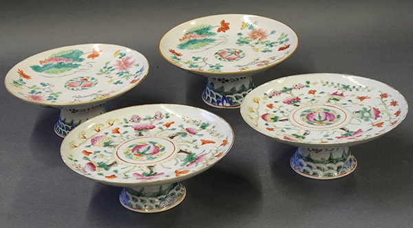 Chinese Porcelain Footed Dishes: (lot of 4) Chinese enameled porcelain footed dishes, decorated with various flowers including lotus and peonies on the white ground, green auspicious bats on the exterior, flower and wave pattern on t