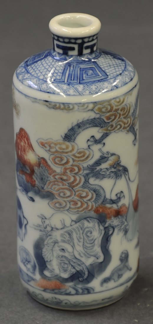 Chinese Table Snuff Bottle 19c: Chinese underglaze blue and red porcelain table snuff bottle, 19th century, featuring various animals including a dragon, tiger and elephant, the base decorated with flowers on a stand, 5"h