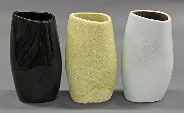 Bauer Atlanta, Russel Wright art pottery: (lot of 3) Bauer Atlanta, Russel Wright art pottery, Mid Century shouldered vases glazed in black, light blue and mottled chartreuse, 8"h