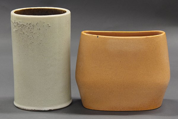 Bauer Atlanta, Russel Wright art pottery vases: (lot of 2) Bauer Atlanta, Russel Wright art pottery vases, one of oval form having an organic cream glaze, 10.5"h, the other of cylindrical form with a sand glaze, 9"h