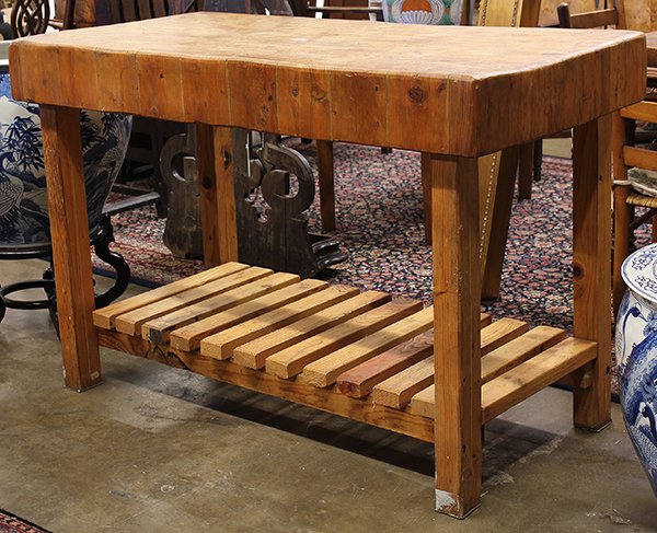 Rustic butcher block island,: Maple butcher block island, having a solid rectangular top rising on square legs, conjoined by slatted lower shelf, 36"h 54"w x 27"d.