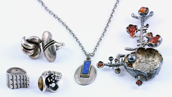 Post modern gemstone silver carnelian tiger's eye lapis: Collection of post modern gemstone and sterling silver jewelry including one large brooch with carnelian accents, 8 3/4 inches; One lapis lazuli pendant necklace, 24 inches; Together with (3) rings, o