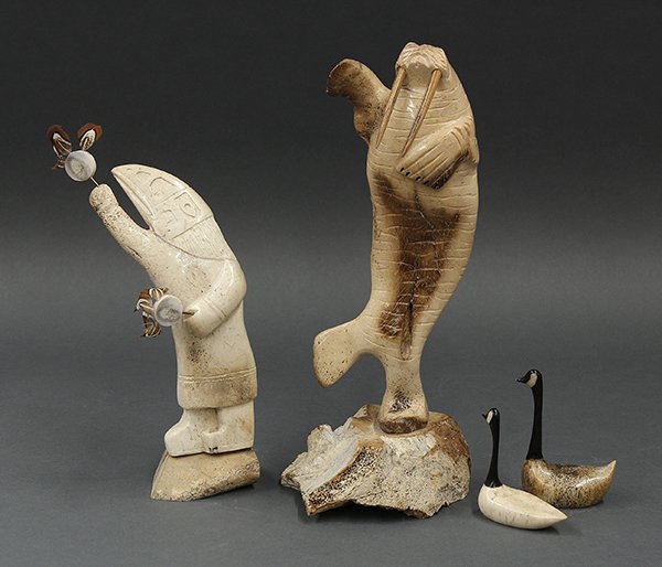 Inuit, authentic Alaskan bone carvings: (lot of 4) Inuit, authentic Alaskan bone carvings consisting of an anthropomorphic figure of a raven, a standing figure of a seal and a pair of geese, largest: 12.5"h. Provenance: Property from the co