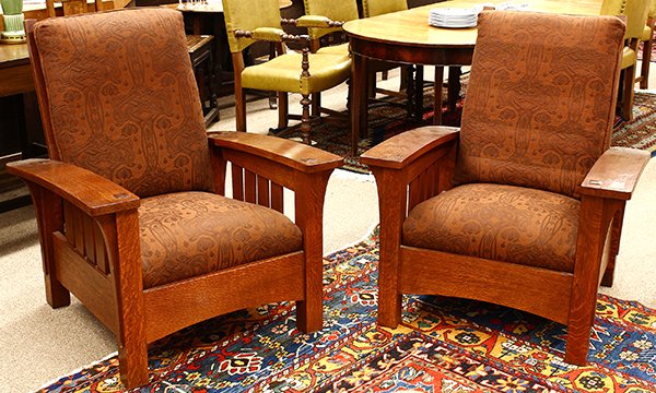 Pair of Arts and Crafts style Stickley (E.J. Audi): Pair of Arts and Crafts style Stickley (E.J. Audi) bow-arm morris chairs, late 20th century; executed in quartersawn white oak, the wide arms with thru tenon construction surmounting the long corbels