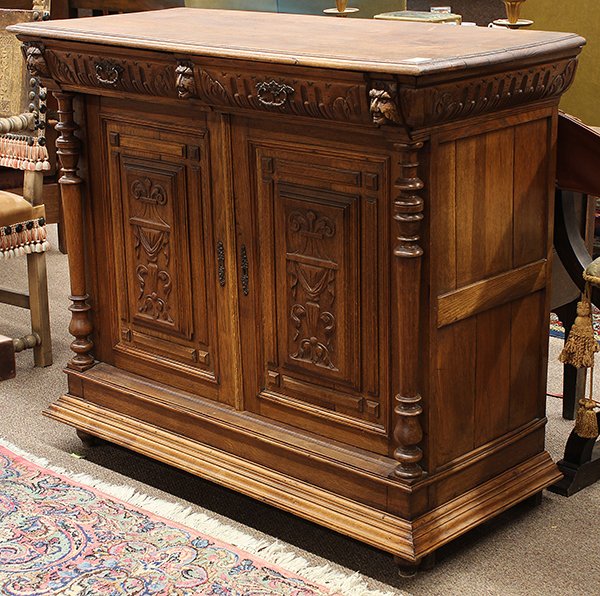 Henri II oak buffet: Henri II oak buffet, the rectangular top having two drawers above the panelled case flanked by baluster turned supports, and rising on a molded base terminating on compressed feet, 40"h x 46"w x 20.5"