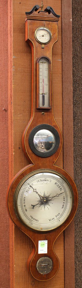 English barometer: English barometer, 19th century, the three window instrument centered with a convex mirror, and having a mahogany case accented with stringing, 38"h x 10"w
