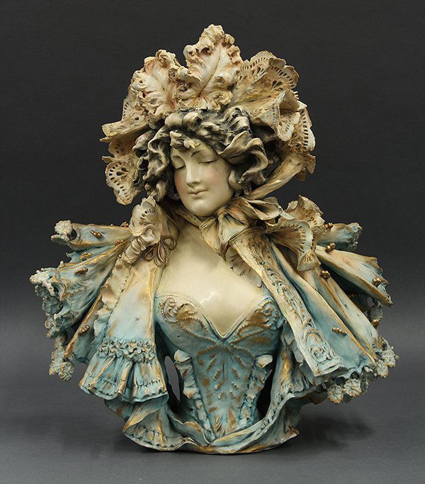 Glazed earthenware Amphora figural sculpture: Reissner Stellmacher & Kessel glazed earthenware Amphora figural sculpture, (1892-1905), depicting a lady dressed in formal attire, having a tapered waist with gilt accents and marked Turn, Teplitz Bo