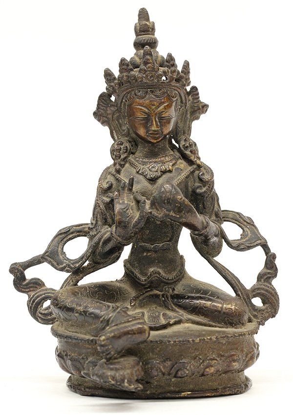 Himalayan Bronze Tara: Himalayan patinated bronze Buddhist figure, of Tara holding a sacred jewel and seated in royal ease above a lotus pedestal, 6"h
