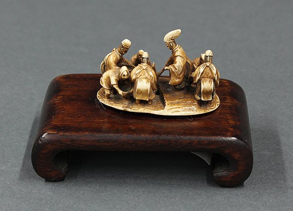 Japanese Ivory Netsuke 19c: Japanese ivory netsuke, now as an okimono, a Shinto priest starting the ground breaking for rice planting, signed [Kosetsu], 1.75"l