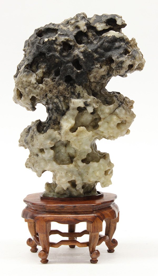 Chinese Scholar's Rock: Chinese soapstone scholar's rock, the tan colored matrix mottled with dark inclusions, with stand, 9.5"h