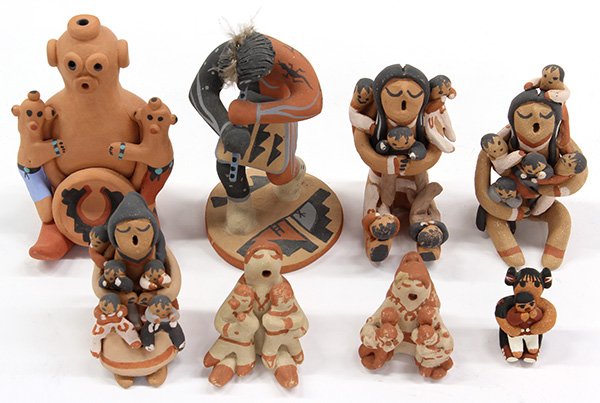 Native American Pueblo story teller figures: (lot of 8) Native American Pueblo story teller clay figures, together with a Kokopelli flute player, all signed, tallest, 5"h.
