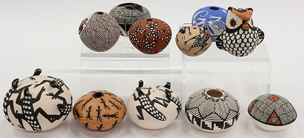 Diminutive Acoma Pueblo style associated pots: (lot of 11) Diminutive Acoma Pueblo style seed jars all having typical incised and painted decoration, some with lizard effigies, together with an owl form pot, signed vy R Leno, LR Toya, M. Antonio, 