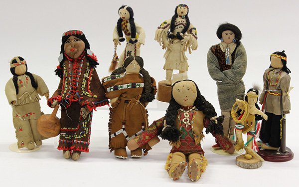 Native American dolls: (lot of 9) Native American dolls including Iroquois corn husk, cloth, and hide examples, each traditionally dressed with some beadwork, largest: 11.5"h Provenance: Property from the collection of the