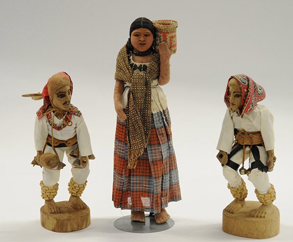 Native America style dolls: (lot of 3) Native American style dolls consisting of a pair of carved wooden dolls by Sondra Arnulfo; together with a Mexican carved wood and cloth female example, 15"h