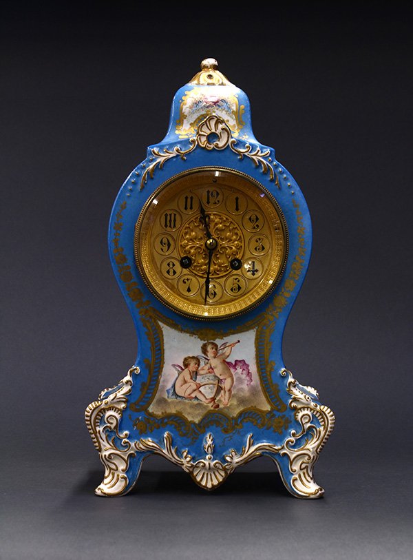 French faience mantle clock,: French faience mantle clock, late 19th century, in the neo-classical taste, having hand painted faience body with cartouches depicting ribbons, swags, and flowers, and putti, marked France and Longwy,