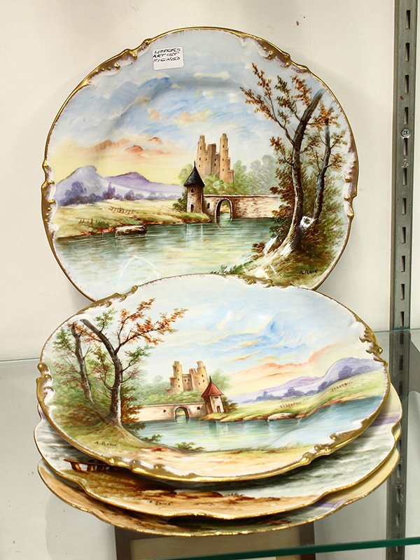 Limoges hand painted scenic plates,: (lot of 4) Limoges hand painted scenic plates, signed by 'A. Rene,' consisting of (2) pairs of mirror images, one depicting castles and the other marine scenes, on plates with shaped and gilt rims, 9.