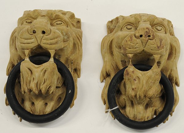 Figural carved door mounts: Figural carved door mounts, 19th century, the lion form knockers with iron rings hanging from the open jaws, 9"h x 6"w