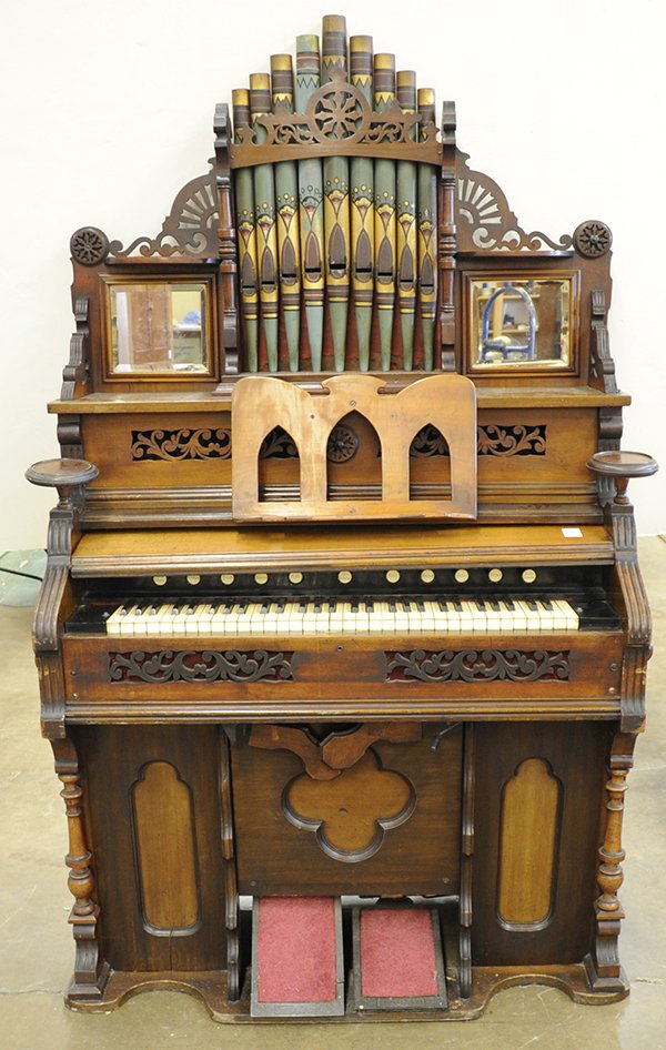 Victorian aesthetic movement pump organ,: Victorian Aesthetic Movement pump organ, executed in walnut with exposed and polychrome decorated pipes, pierced crest, beveled mirrors to either side of pipes, candle holders, and quatrefoil cut outs