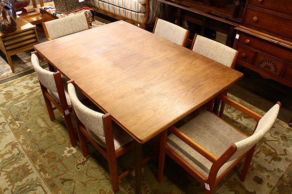 Danish modern teak draw leaf dining table: (lot of 9) Danish modern teak draw leaf dining table and eight chairs, table has a rectangular top above two leaves, rising on round legs, the Mid-century style chairs of square form with wool upholst