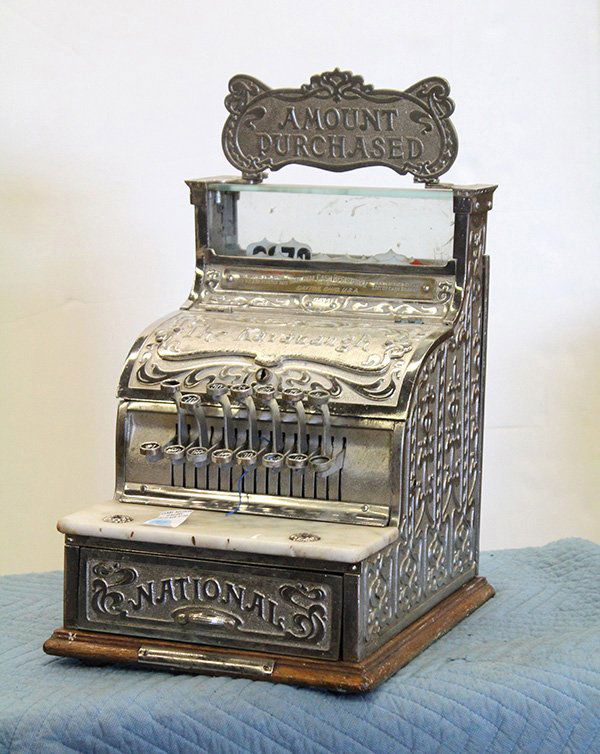 National Cash Register, 'candy store' model No 311: National cash register, 'candy store' model No 311, in silver finish with double-sided 'Amount Purchased' top sign and all over Art Nouveau low relief decoration, 19"h x 12"w 13.5"d.