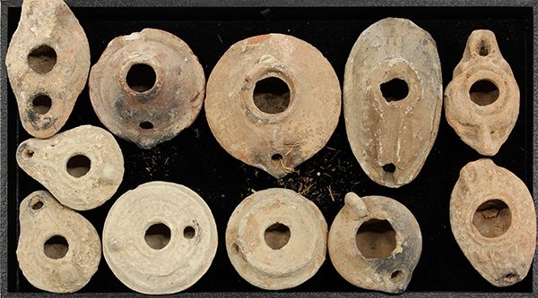 Ancient style terra cotta oil lamps,: (lot of 11) Terra cotta oil lamps, possibly Roman or Byzantine, (damages) largest 4.5"l. Note: Sold on behalf of the Bankruptcy Trustee. There is no Buyer's Premium on this lot