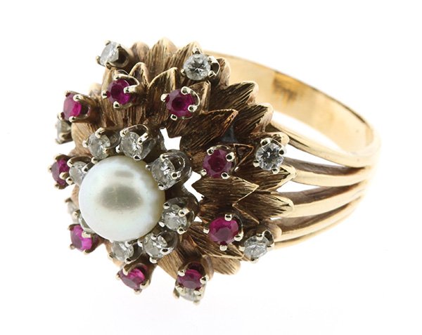 Vintage cultured pearl ruby diamond yellow gold ring: Vintage cultured pearl, ruby and diamond ring centered by one 6.1 mm cultured pearl, accented by (16) single cut diamonds totaling approximately 0.36 ct., and (9) small round rubies set in a 14K yello