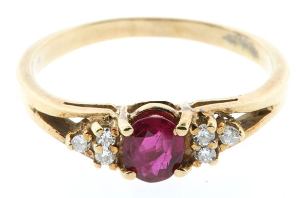 Ruby and Diamond Ring: Ruby and Diamond Ring featuring (1) oval cut ruby weighing approximately 0.40 ct., accented by six full cut diamonds totaling approximately 0.07 ct., set in a 14k yellow gold mounting, size 6 1/4, 2.2
