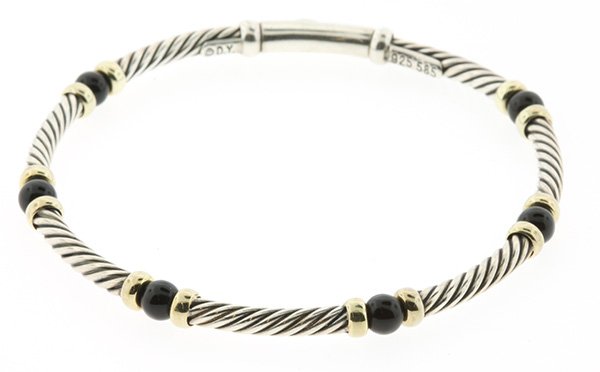 David Yurman 14k yellow gold and sterling silver: David Yurman 14k yellow gold and sterling silver bracelet Flexible bracelet signed D.Y., 14k, 925, 9.6 grams, 6 3/4 inches