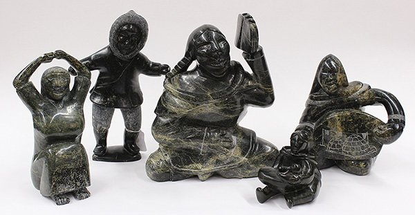 Inuit carved soapstone figural sculptures: (lot of 5) Inuit carved soapstone figural sculptures, one depicting a mother and child, signed and numbered on bottom; another of a seated lady with arms outstretched overhead, bearing carved marks on