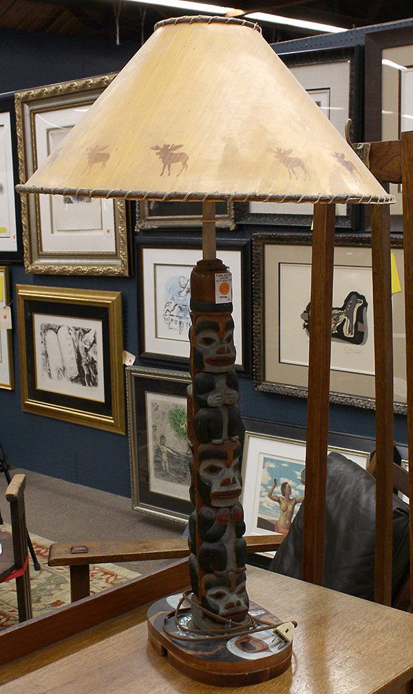 Pacific Northwest coast carved totem pole: Pacific Northwest coast carved totem pole, now mounted as a lamp, having a figural carved standard executed in black, red, and light blue pigment, the base with abalone inlay, totem 25"h x 11"w