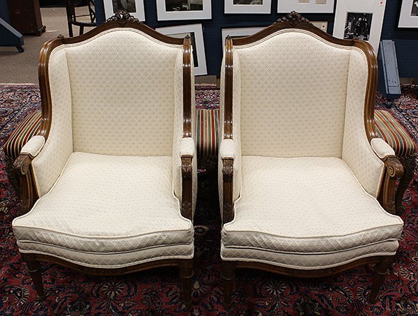 Pair of Louis XVI style bergeres: Pair of Louis XVI style bergeres, having a carved crest surmounting the shaped back terminating at the carved acanthus returns and rising on fluted legs, 41"h x 24"w x 23"d