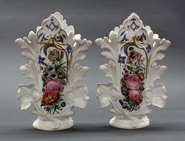 Pair of Continental polychrome decorated vases: Pair of Continental polychrome decorated vases, 19th century, each having a polychrome and partial gilt floral medallion on a white ground, and rising on an oval base, marked with a conjoined AA and n