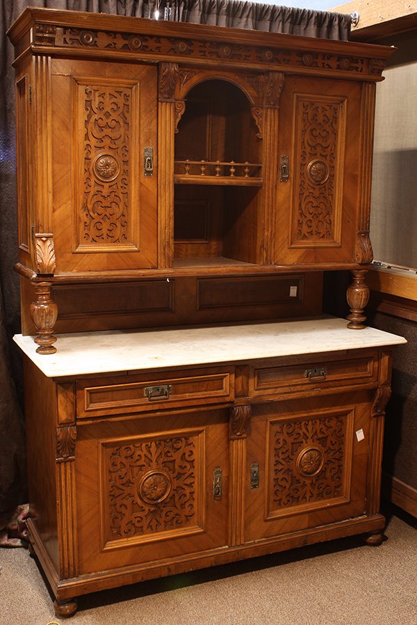 Continental marble top buffet: Continental marble top buffet, 19th century, the panelled two door superstructure with a central gallery above the carerra marble top, the lower case with applied scroll decorated doors, and rising on