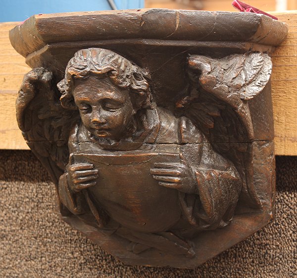 Continental carved wall bracket: Continental carved wall bracket, 19th century, the contoured top above the winged angelic reserve continuing to the shaped back, 10"h x 10"w