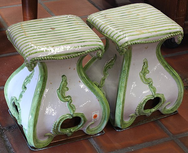 Pair of Continental earthenware garden seats: Pair of Continental earthenware garden seats, 19th century, having a stylized top with tassel accents surmounting the flaring base with pierced accents, underside with copper liners to be used as plan
