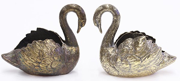 Pair of German sterling silver-gilt swan form table: Pair of German sterling silver-gilt swan form table ornaments, each with all over repousse feather decoration and articulated wings, 5.25"h x 6.5"l x 3.5"w, 20.40 troy oz