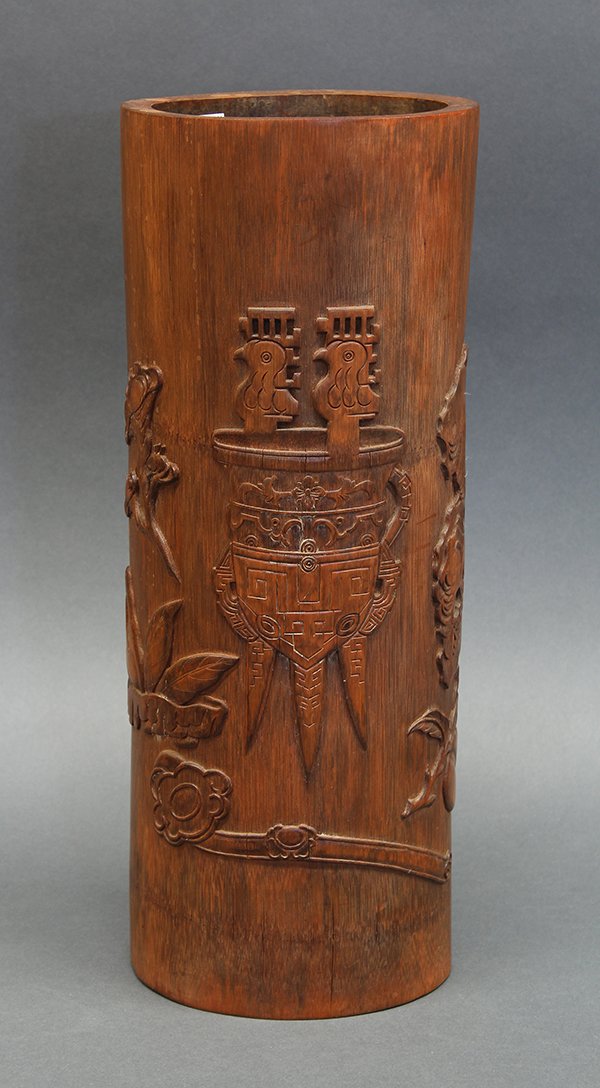 Chinese Bamboo Brush Pot: Chinese large bamboo brush pot/vase, carved with a bronze jue vessel, ruyi scepter, Buddha hand citron, peach and scholar's rock, reversed with a seven character poetic line, incised with the cyclical