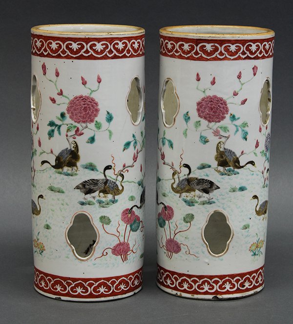 Chinese Porcelain Hat Stands: Pair of Chinese porcelain hat stands, of cylindrical form with lobed apertures, enameled with geese amid peonies and with ruyi bands at the rim (one with hairline crack), 11.5"h