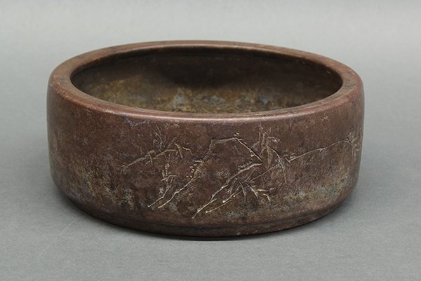 Chinese Large Zisha Brush Washer: Chinese zisha ceramic brush washer, the exterior incised with bamboo and a mountain, along with a colophon and the cyclical date bingyin, bearing signature Yang Baonian, the base with studio mark, 9.1