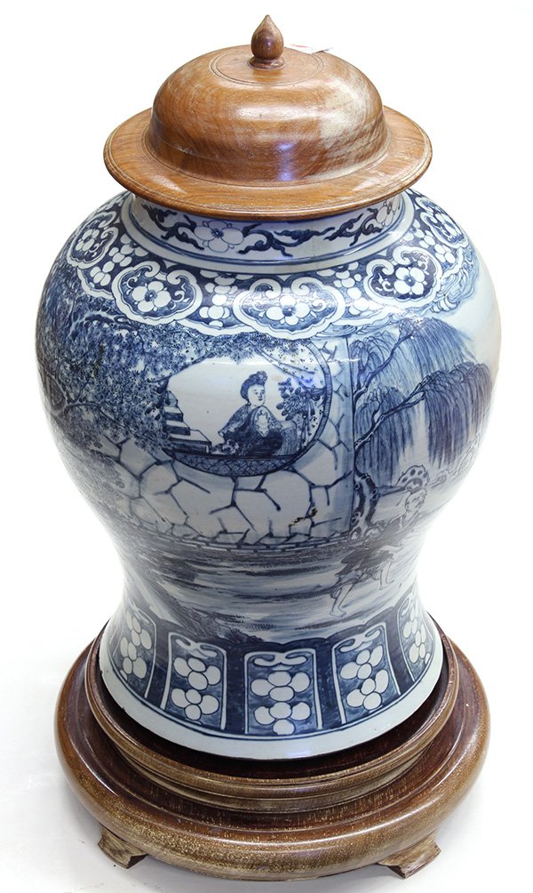 Chinese Large Blue-and-White Jar: Chinese underglaze blue porcelain jar (jiangjun guan), decorated with a beauty gazing at a fisherman outside her window, the splayed base with a lappet band (neck repaired), with wood stand and lid, j