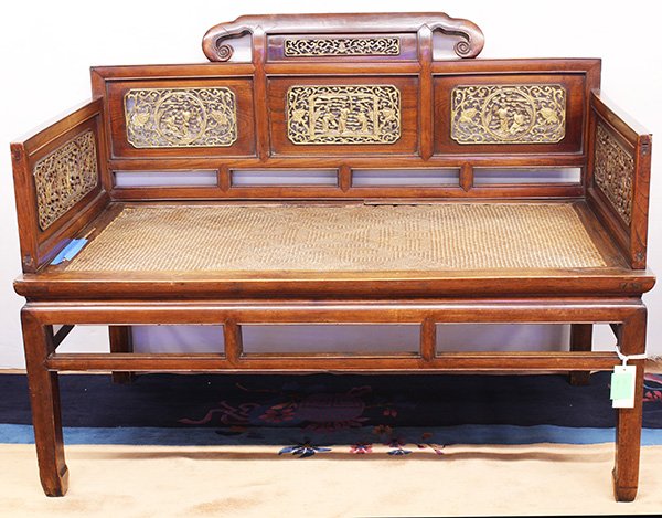 Chinese Elm Wood Throne, 18/19th c: Chinese gilt elm wood (yumu) throne, 18th/19th century, with a ruyi form back rail framing inset gilt panels pierced with figures amid tendrils, the arms with panels decorated en suite, with a rectang