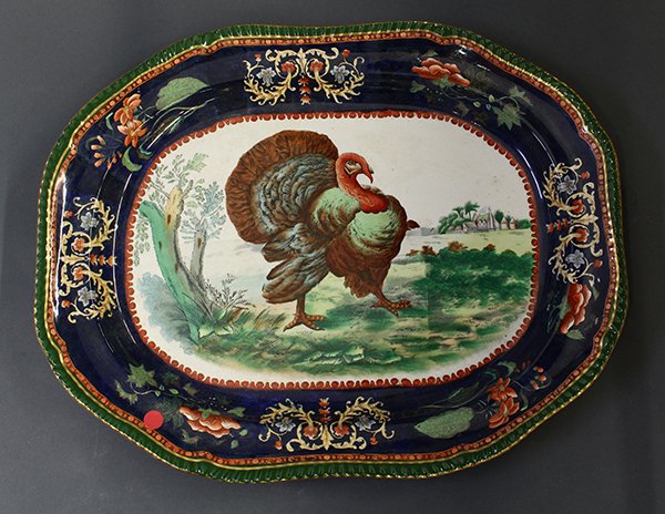 Large Copeland Spode turkey platter: Large Copeland Spode turkey platter, 19th century, executed in ironstone with shaped gilt rim, having green and cobalt bands, the cobalt band with scrolls and floral decoration, centering a polychrome