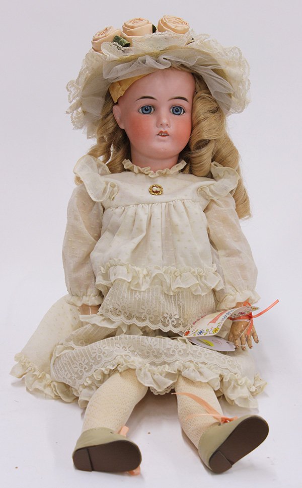 German Gans Seyfarth bisque head doll: German antique bisque head doll by Gans Seyfarth, the hand decorated socket head set with blue paperweight eyes, painted lashes, molded and feathered eyebrows, and an open mouth showing teeth attached