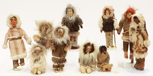 Inuit dolls: (lot of 10) Inuit dolls with carved wood faces, and wearing fur parkas, and leather & fur mucklucks, tallest, 11"h.
