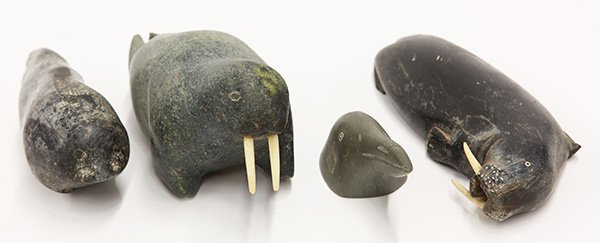 Inuit figural hardstone carvings: (lot of 4) Inuit hardstone carvings, consisting of two walrus figures, a seal figure, and a bust of a sea bird, largest 8"l x 3.5"w Provenance: Un-accessioned from The Honolulu Museum of Art