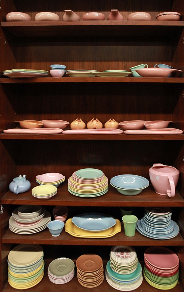 Six shelves of mid-century art pottery tableware,: (lot of approx 175) Six shelves of Mid-Century art pottery tableware, mostly Russel Wright and Lu-Ray, including covered casseroles, serving dishes, pickle servers, creamers, cups and saucers, dinner