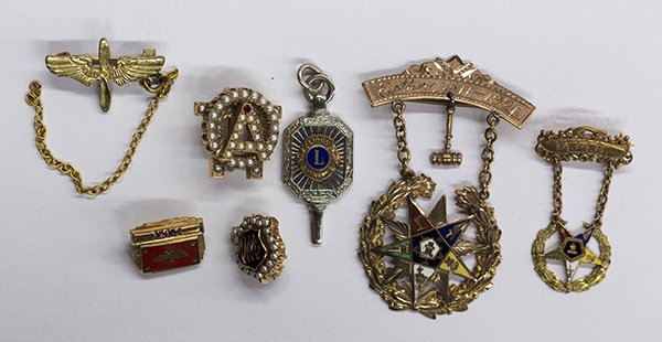 Collection of Masonic pins and pendant: Collection of gold and metal Masonic pins and pendant including two seed pearl and 14k yellow gold Masonic pins; Two 14k yellow gold and enamel Masonic pins; One enamel and 10k yellow gold Masonic pin