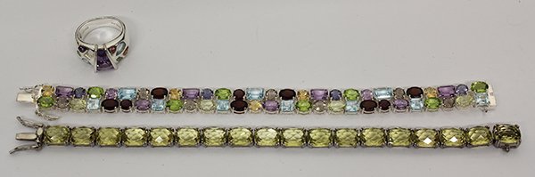 Collection of gem and sterling silver jewelry: Collection of gem and sterling silver jewelry including two bangle bracelets and one ring, set with citrine, garnet, amethysts, peridot etc. Note: one stone is missing from the ring; 57 grams