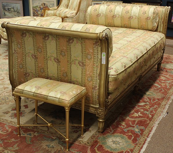Louis XV style day bed: (lot of 2) Louis XV style day bed, of sleigh form, the carved frame accented with gilt highlights, covered in gold and peach floral decorated upholstery, and rising on fluted legs, 34"h x 83"l x 37"d;